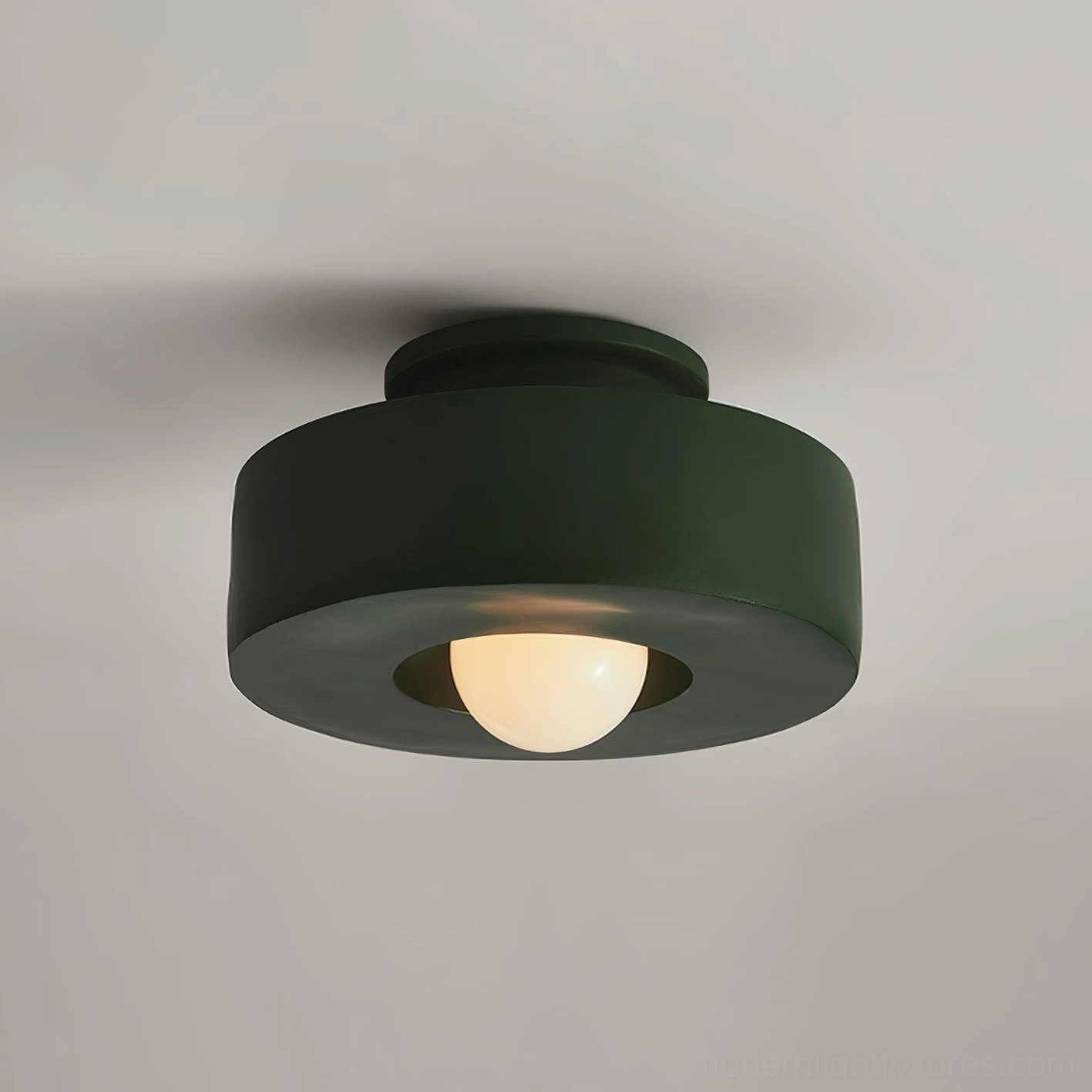 Red Carneros modern ceiling light installed overhead, showing soft diffused illumination effect
