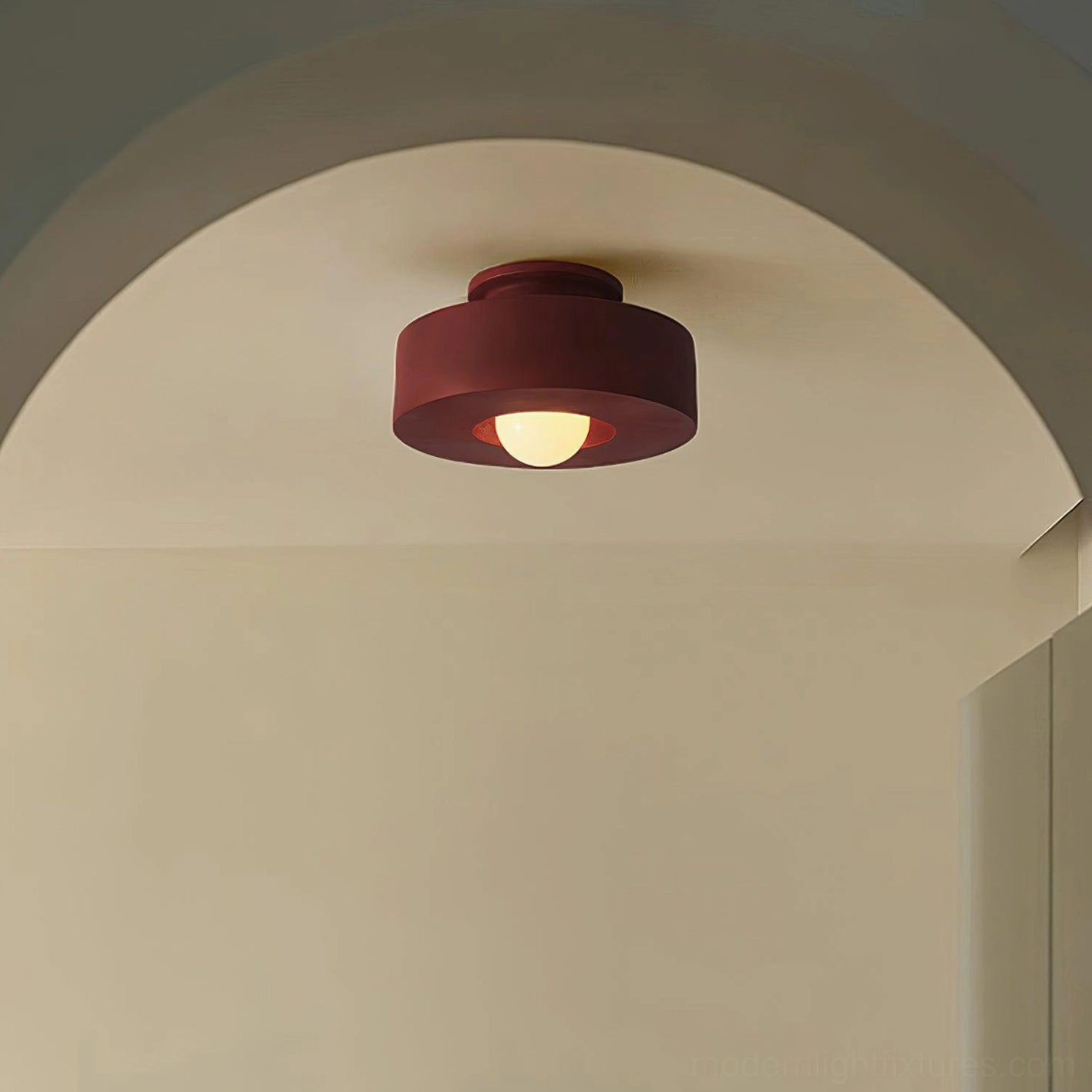 Burgundy Carneros stacked resin ceiling lamp in residential kitchen archway, warm ambient lighting effect