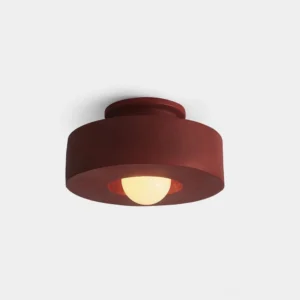 Carneros modern stacked resin ceiling lamp in burgundy red, front overhead close-up view showing cylindrical tiered form