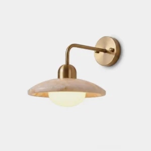 Carolia alabaster wall sconce front studio view with hand-cut natural stone shade and brass J-arm mount