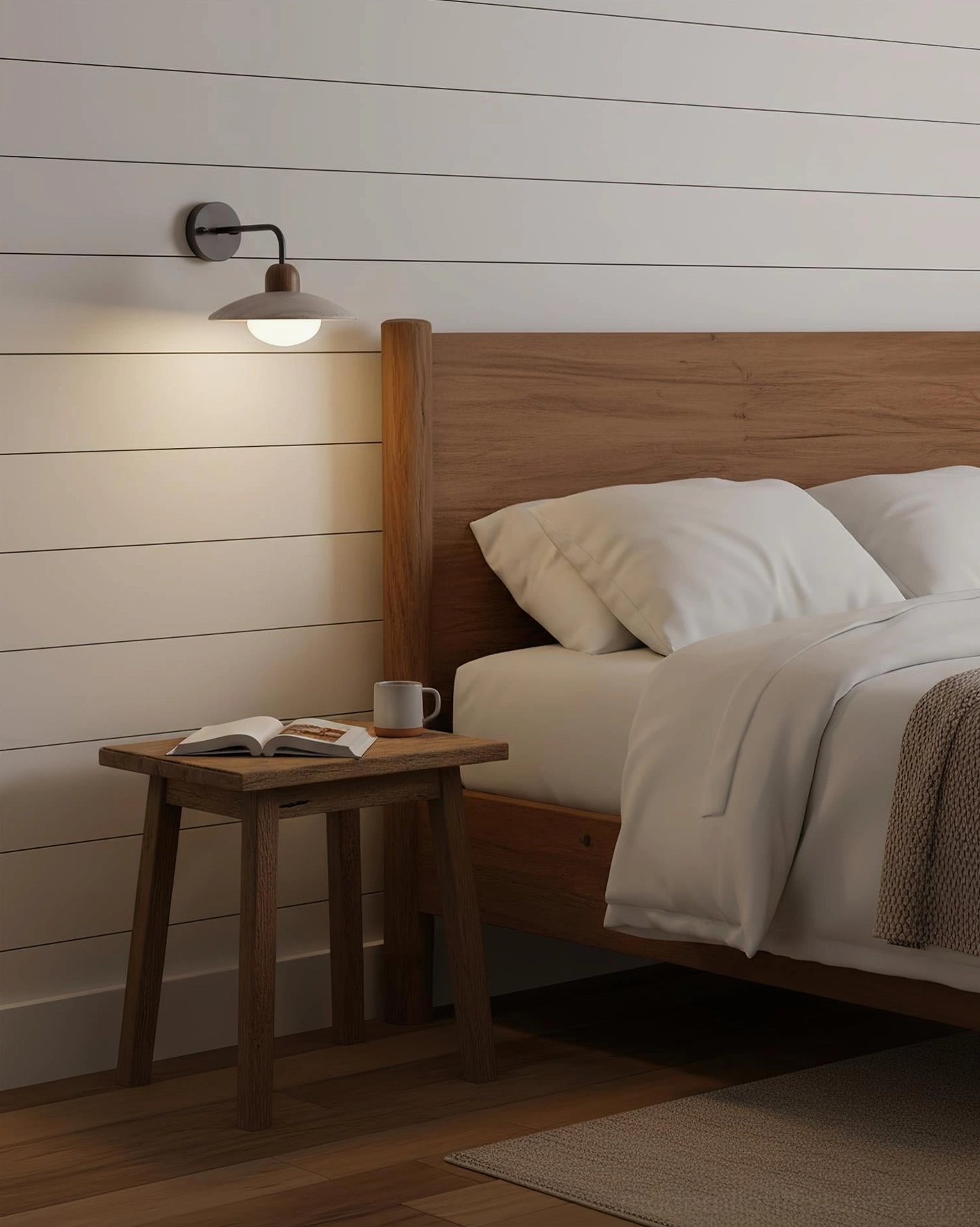 Paired Carolia wall sconces flanking bedroom mirror providing symmetrical balanced illumination