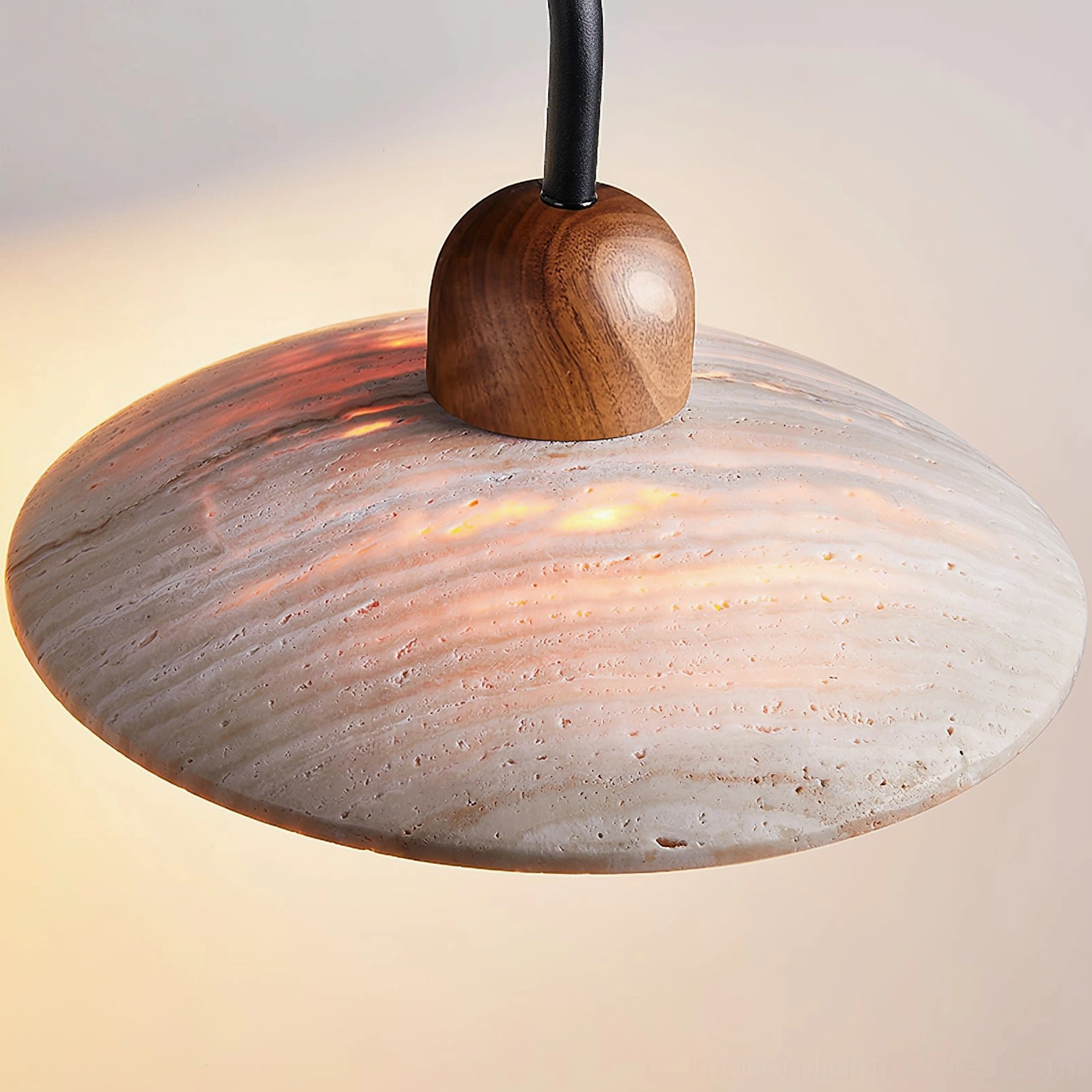 Carolia travertine wall lamp mounted beside bedroom mirror in balanced paired configuration