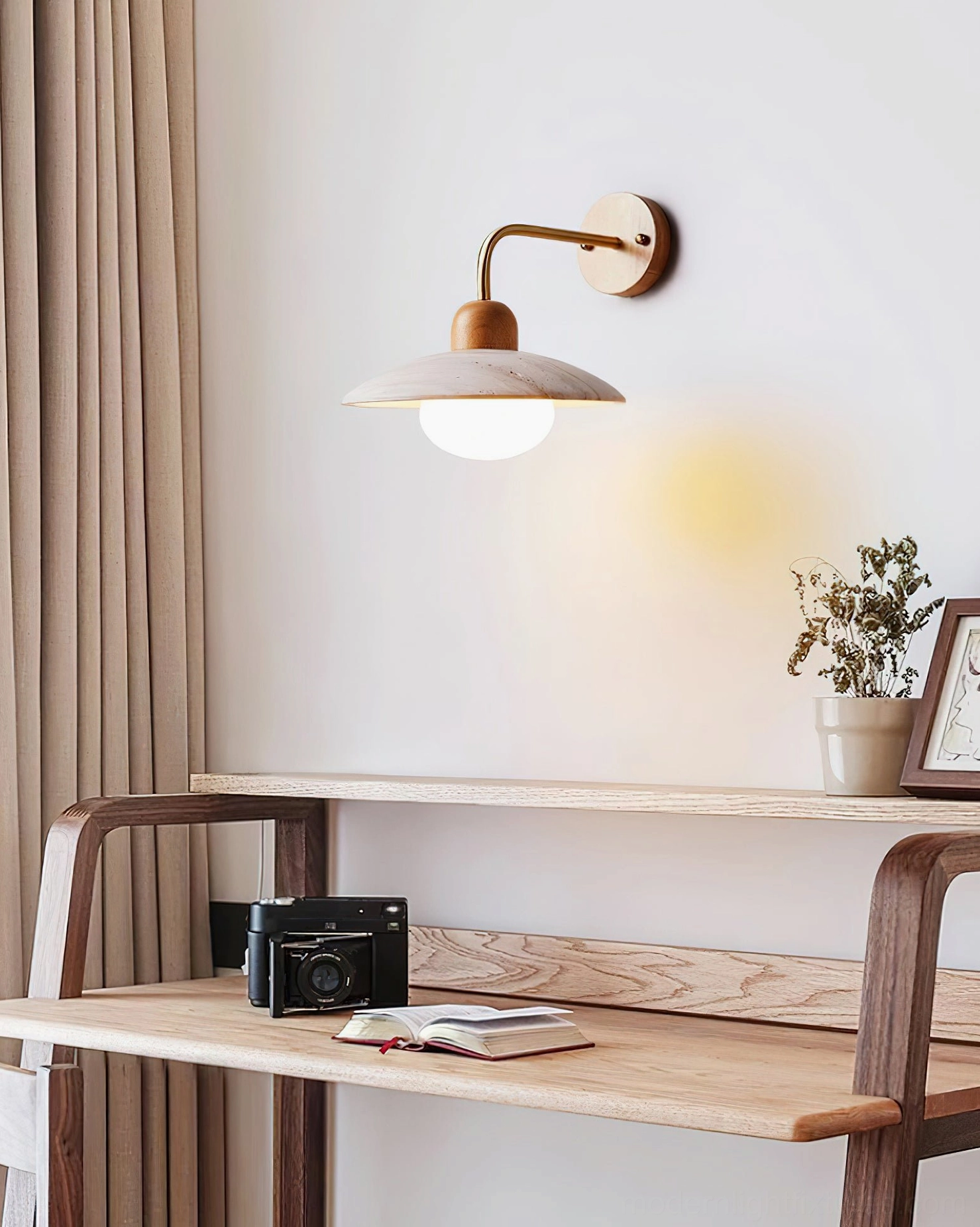 Carolia wall sconce illuminated in evening ambiance showing travertine stone light diffusion warmth
