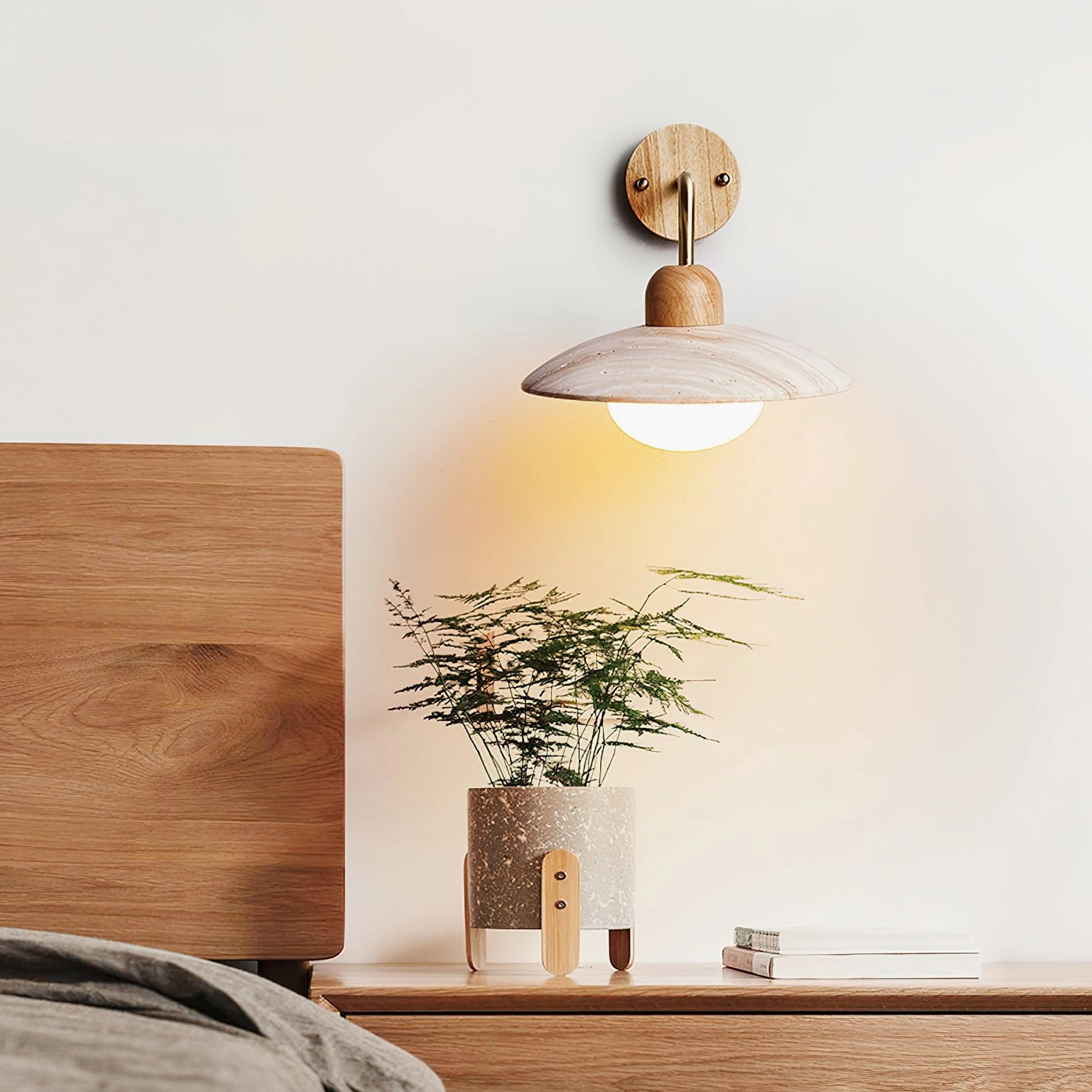 White finish Carolia wall sconce with minimalist aesthetic blending into neutral Scandinavian interior