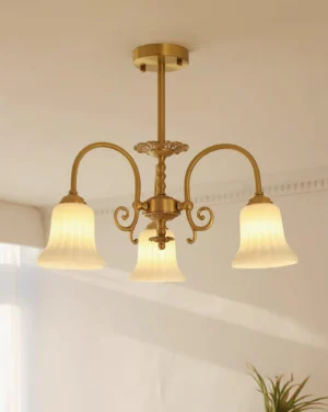 Elegant 3-head brass chandelier with ribbed glass shades installed in minimalist residential interior ceiling