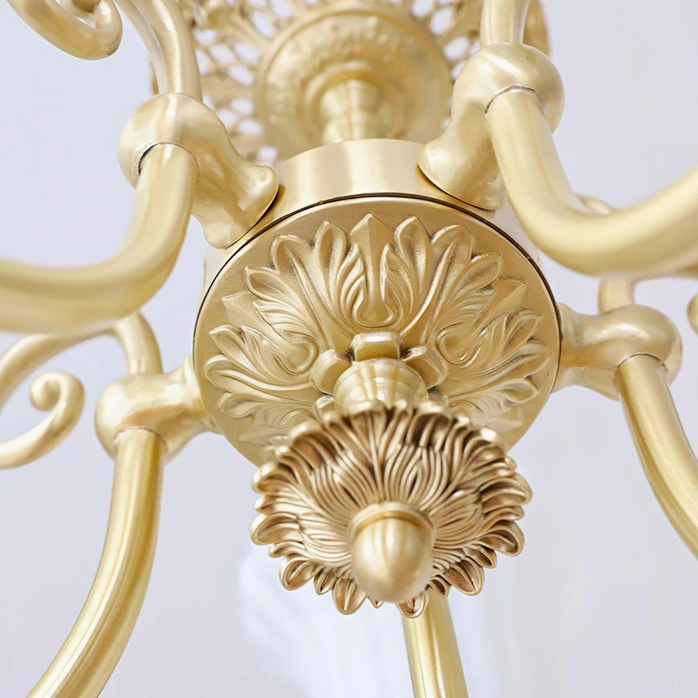 European-inspired brass chandelier creating warm luxury ambiance in residential home setting