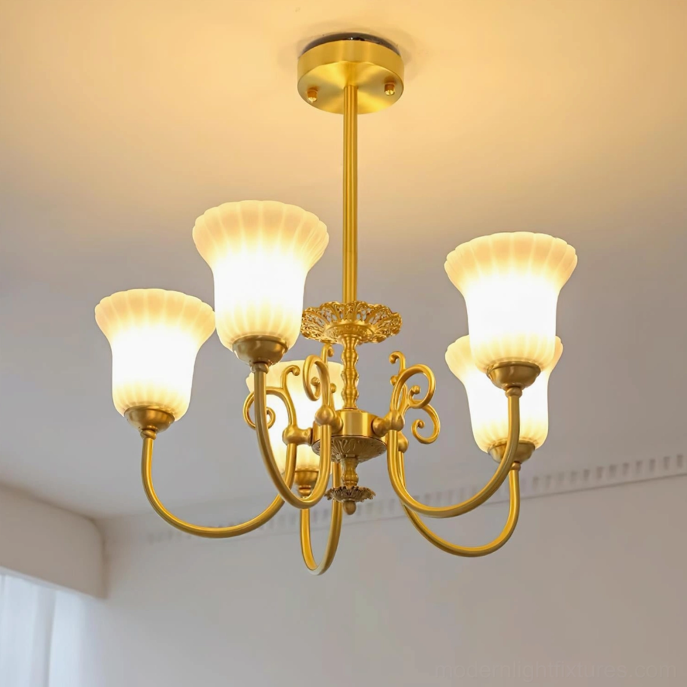 Multiple view angles of brass chandelier with ornate scrolled arms and decorative elements