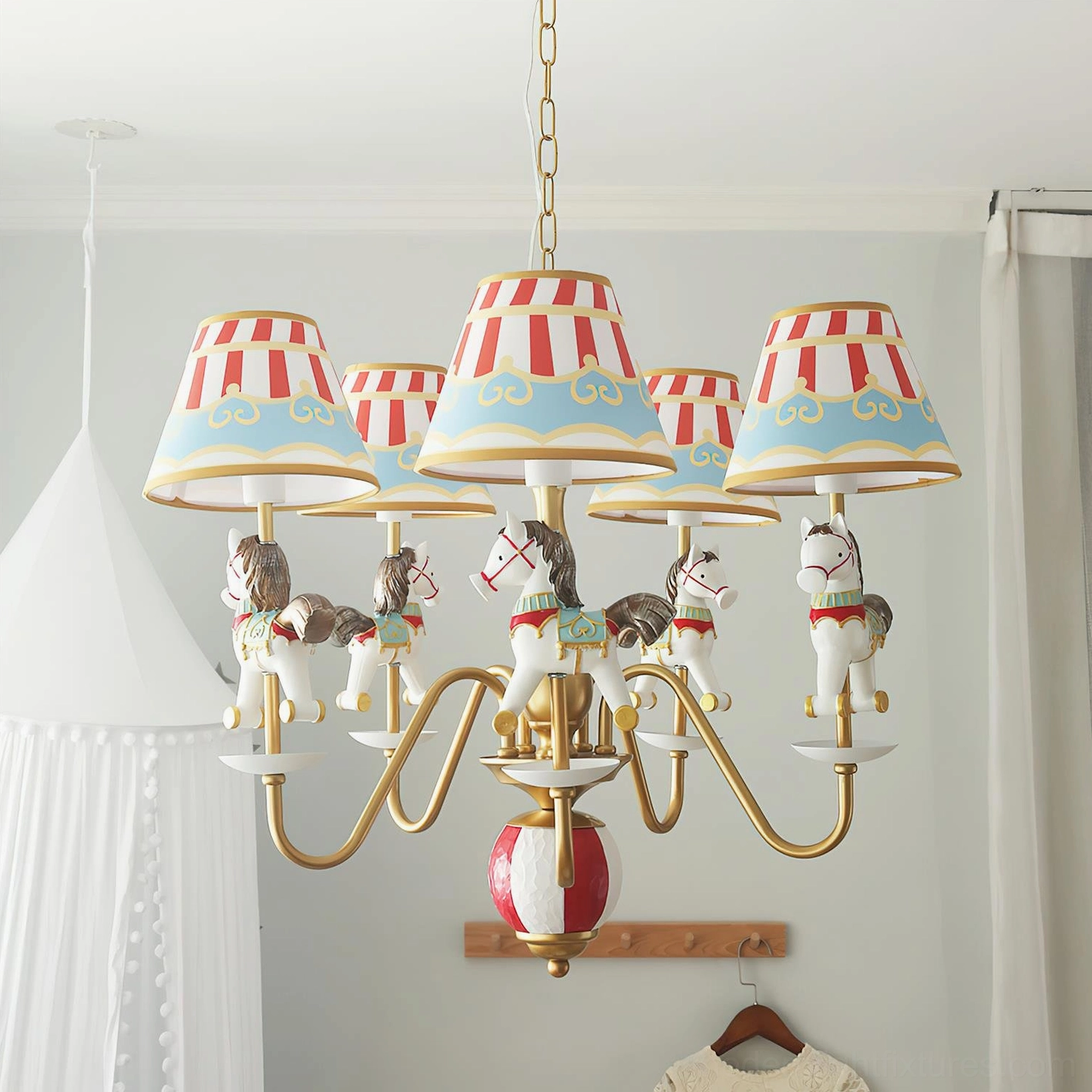 Whimsical carousel chandelier hanging in kid's bedroom featuring gold metal construction, pastel striped lampshades, and horse figurine details