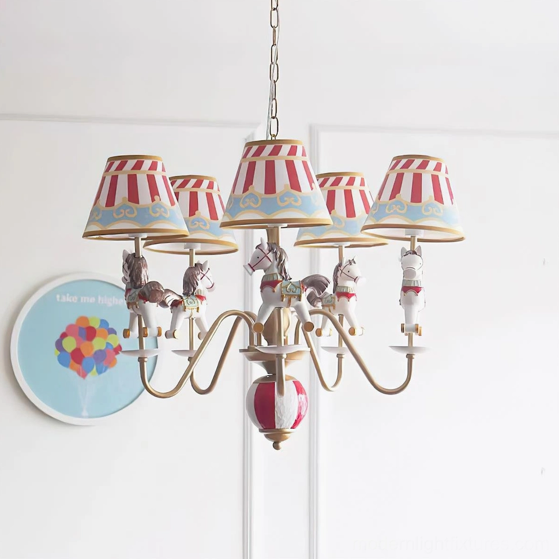 Red and white carousel chandelier with gold metal arms and striped fabric lampshades mounted against minimalist white wall