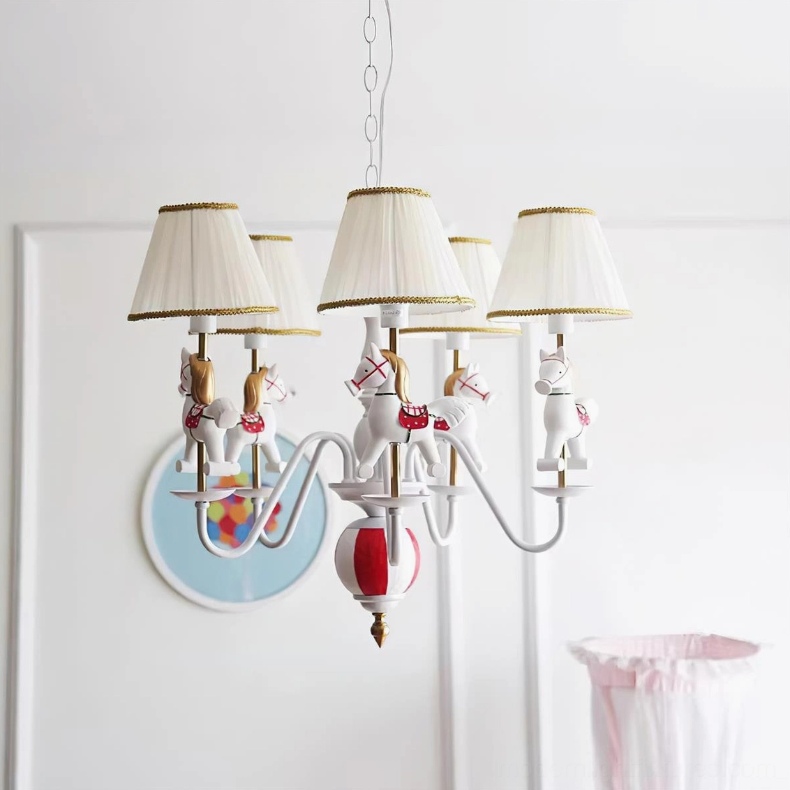Red and white carousel chandelier featuring metal frame, striped lampshades, and miniature horse figurine accents in home setting