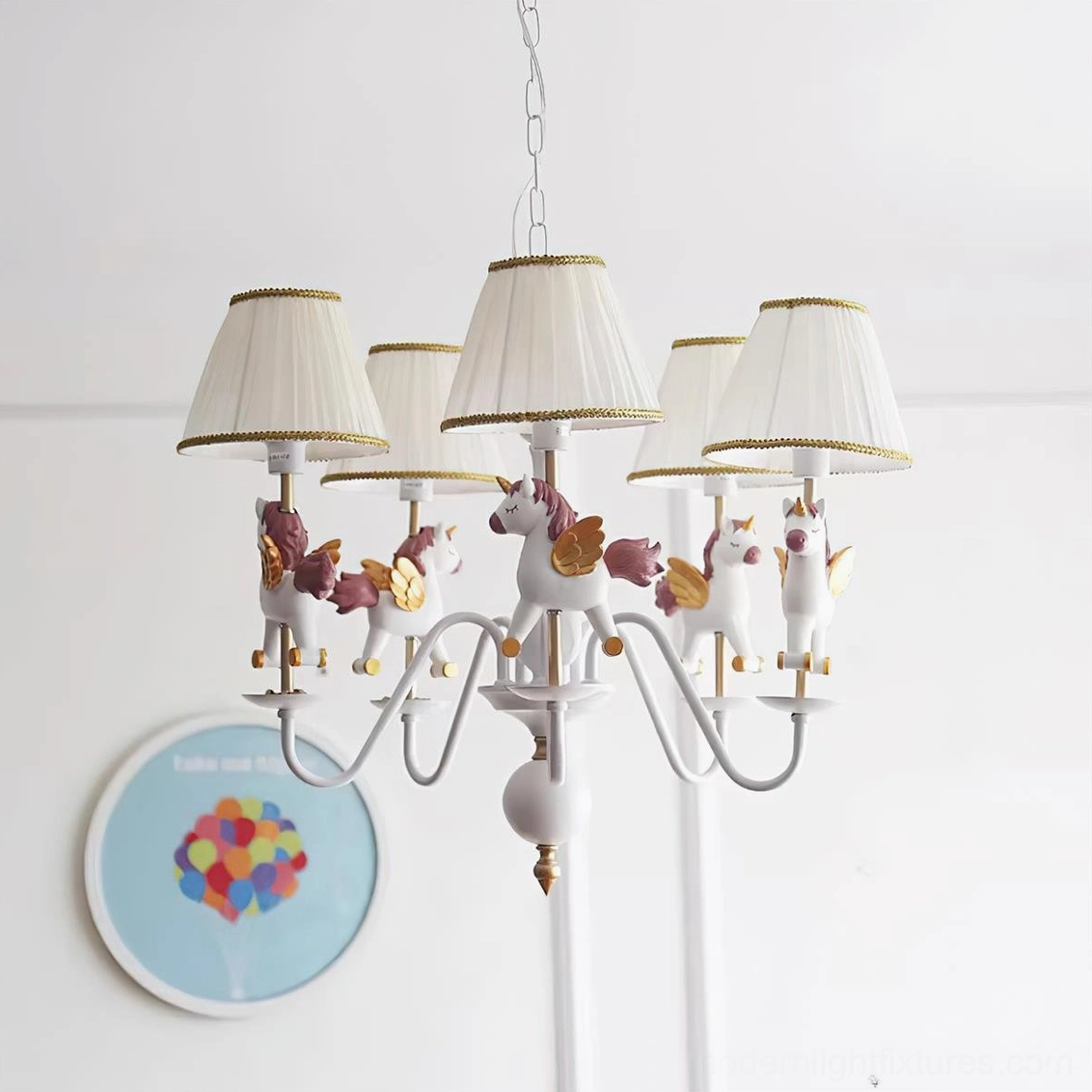 Neutral tone carousel chandelier with white metal frame, beige pleated lampshades, and delicate horse figurine accents in home setting