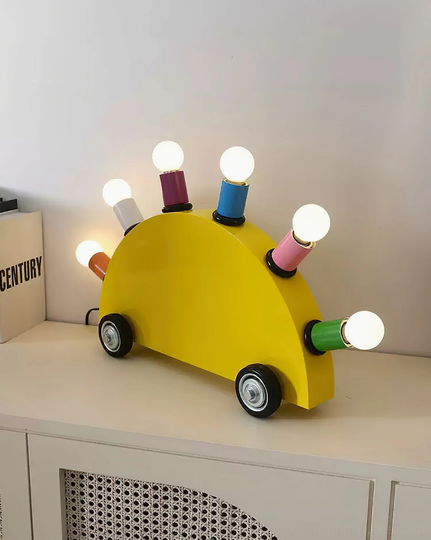 Cartoon car lamp close-up metal body glossy finish rubber wheels detail view