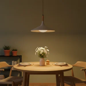 Cascade breeze cement pendant light installed in contemporary dining room, low-angle front view with warm ambient lighting and minimalist table decor