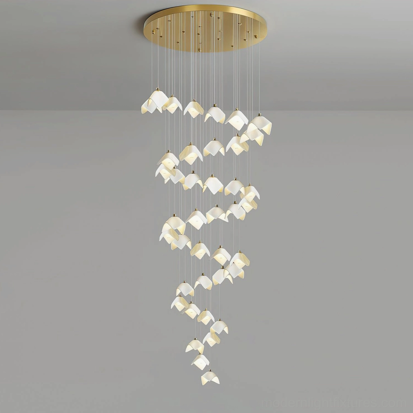Cascading bloom modern floral pendant with gold finish against white background highlighting ceramic shades
