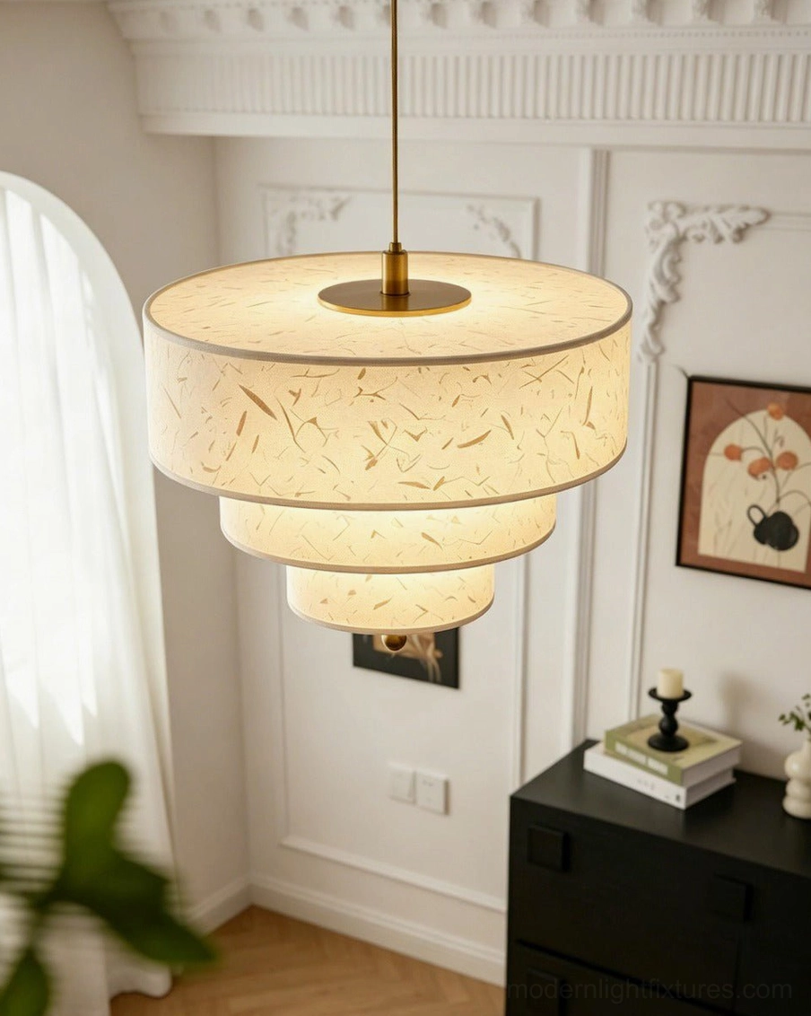 Marvelle pendant light hanging in classic hallway with warm ambient lighting, brass hardware visible, eye-level interior view