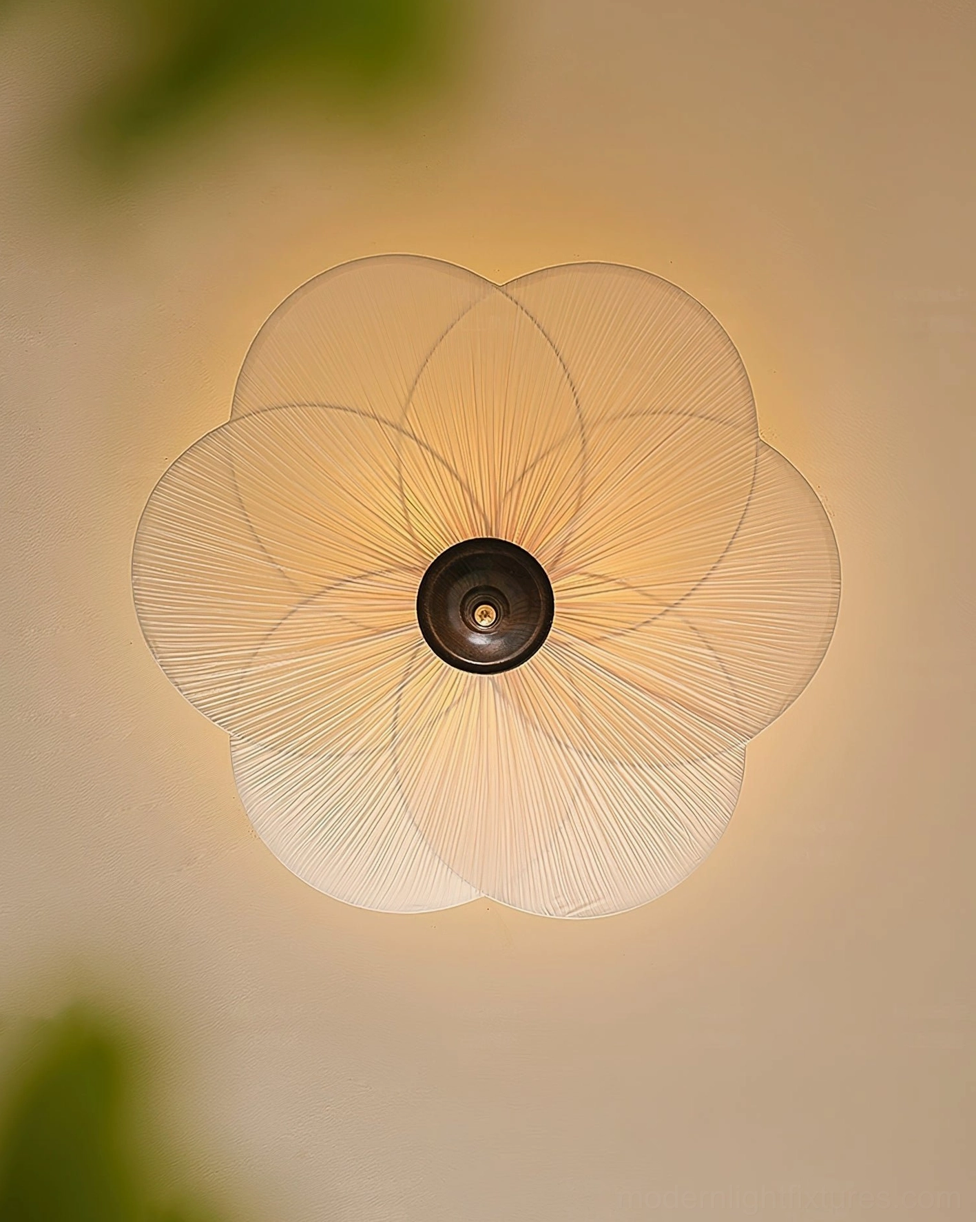 Close-up detail of Caserta pleated fabric shade showing woven texture and radial petal design