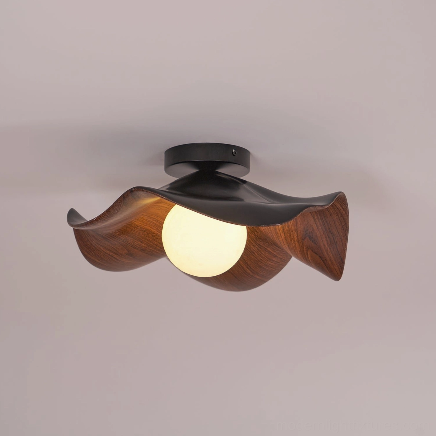 Casia ceiling light fixture showing resin dome with natural topographic surface pattern