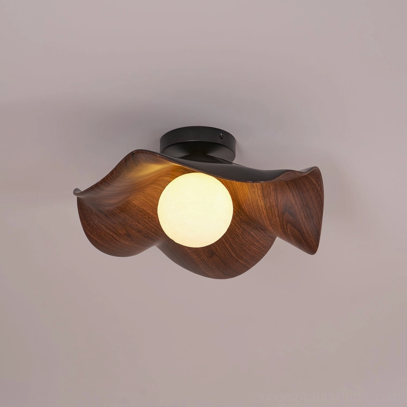 Casia modern ceiling light creating warm layered lighting in residential bedroom