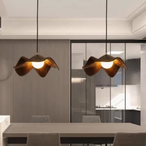 Dual Casia pendant lamps hanging over modern dining table, warm ambient lighting, dark wood shades