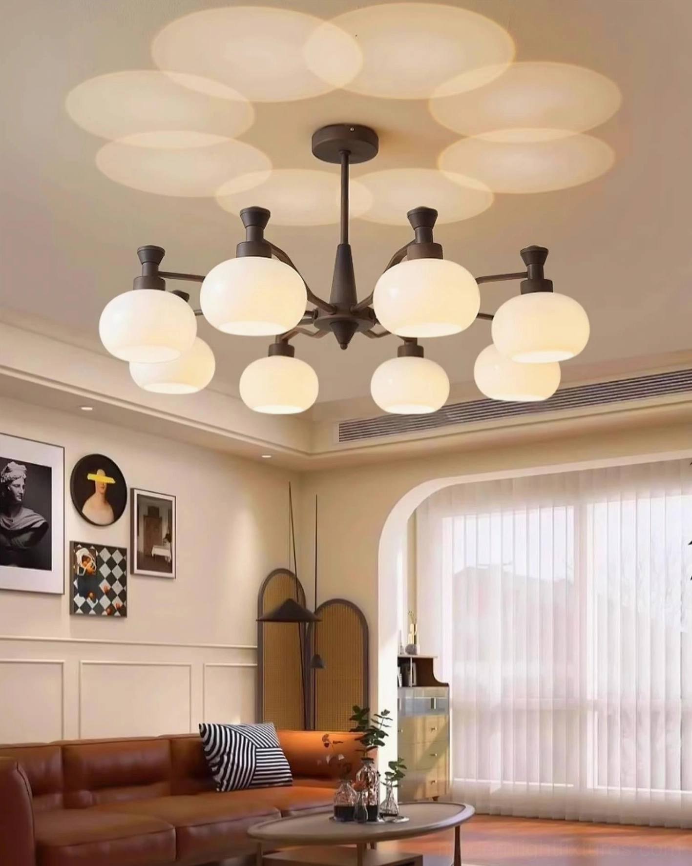 Cassia 10-head modern chandelier in large vintage living room with brown leather sofa, dark brown frame with opal shades
