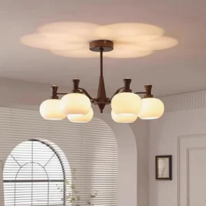 Cassia 8-head chandelier illuminated in vintage American living room with arched window, warm light projection