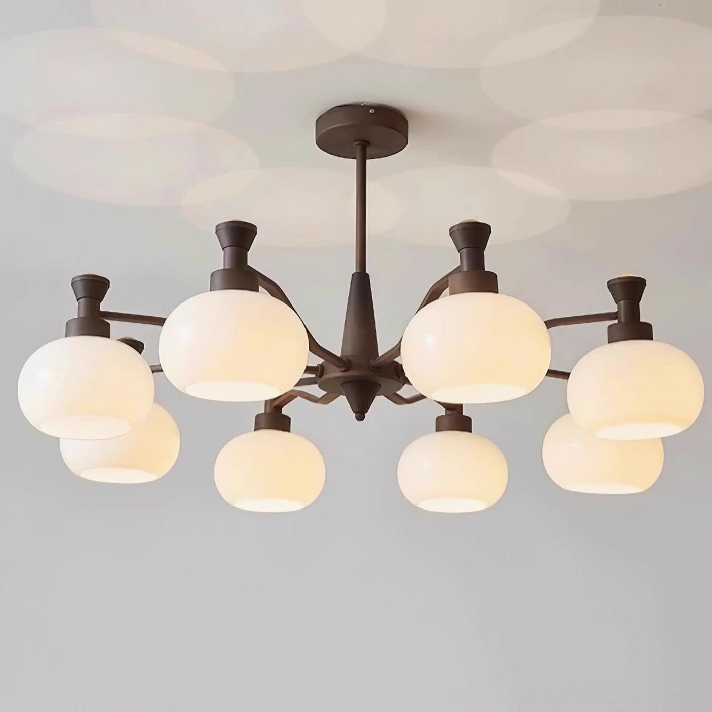 Cassia multi-head chandelier providing ambient lighting in elegant dining room setting