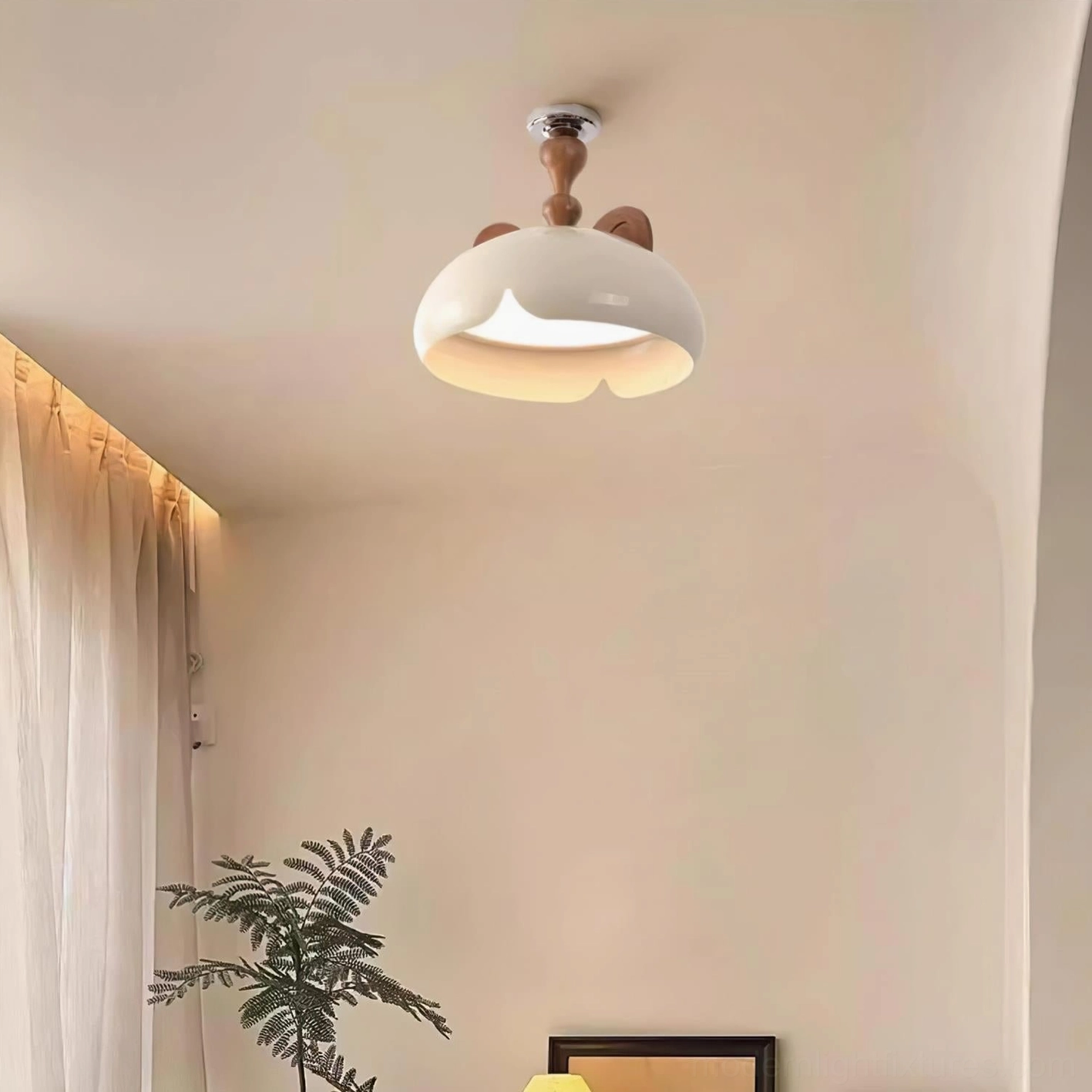 Modern cat ear ceiling light mounted in cozy bedroom with warm ambient illumination and home decor