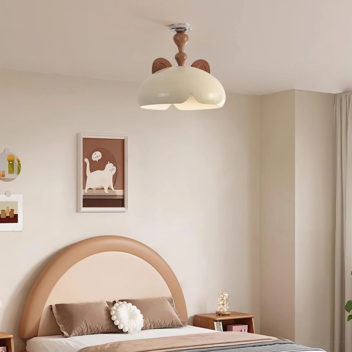 Contemporary cat ear ceiling light fixture above bed with cat-themed wall art and minimalist decor