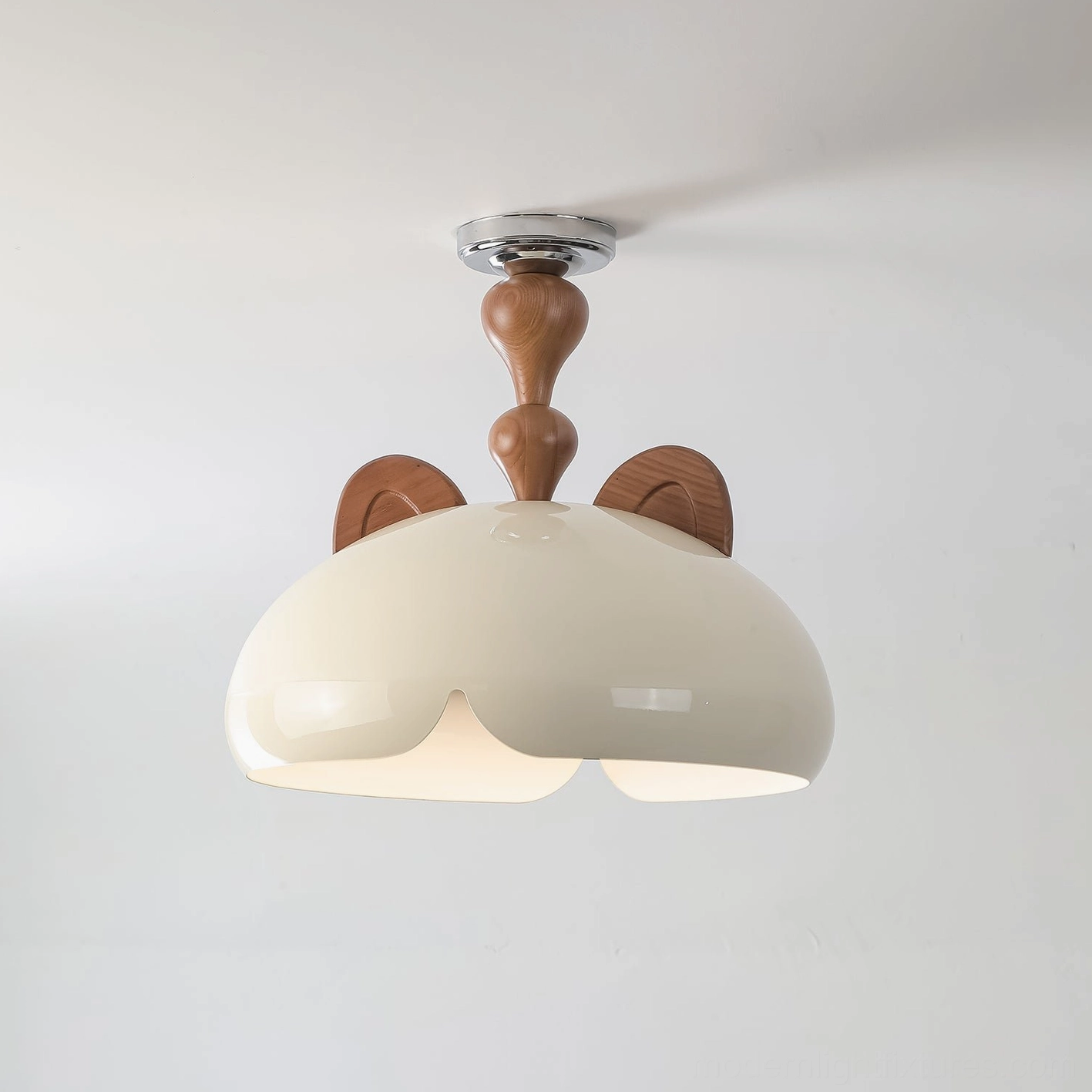 Close-up front overhead view of cat ear ceiling light showing flower-shaped light opening and wooden ears