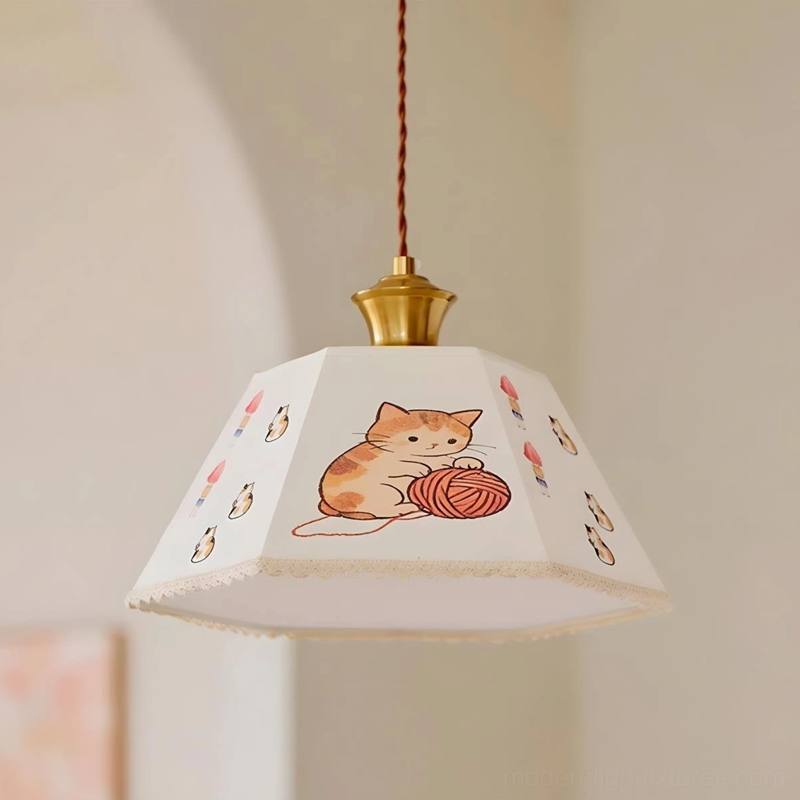 Cat print pendant light with multiple cat illustrations, brass hardware, and twisted cord accent
