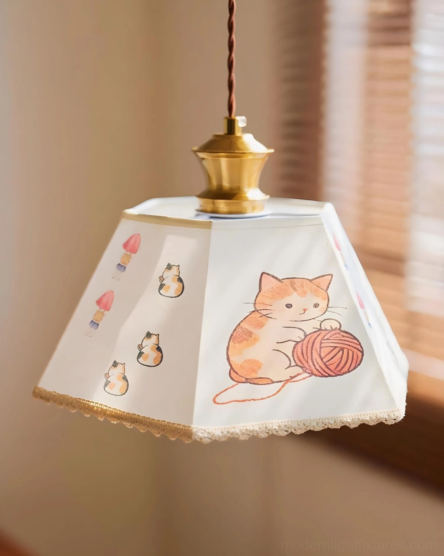 Modern cat print pendant light showing delicate illustrated motifs and brass-toned top hardware