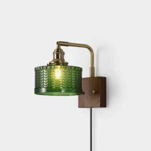 Cavella pressed fish-scale art glass wall sconce with antique brass fittings and walnut wood base - front studio view