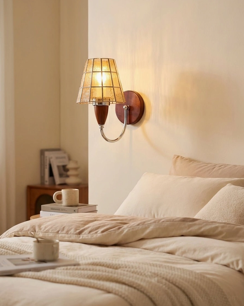 Cavero stained glass sconce creating warm glow in master bedroom neutral decor with amber shade