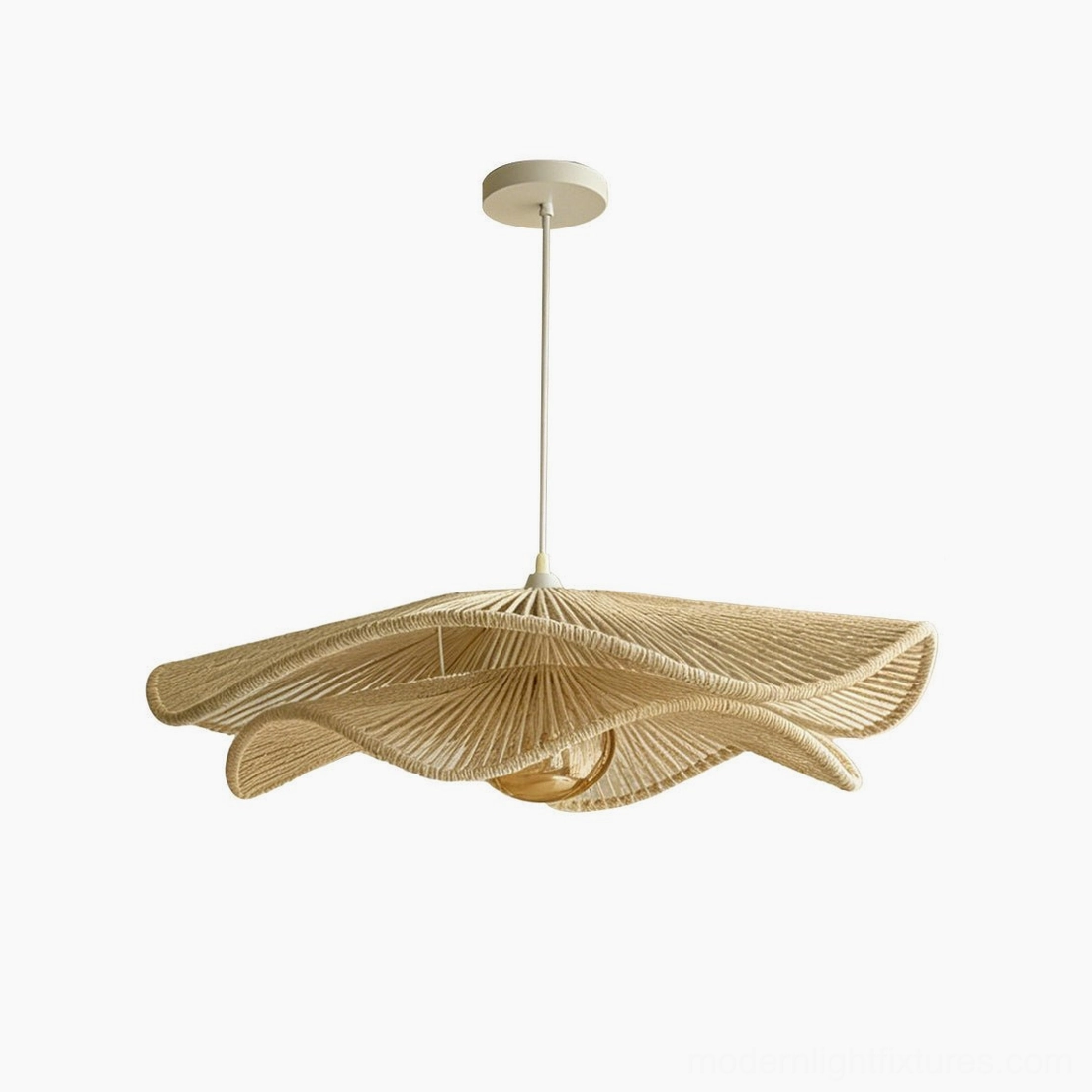 Cazira woven hemp pendant light small size option suspended in interior space, warm natural fiber shade filtering ambient light gently