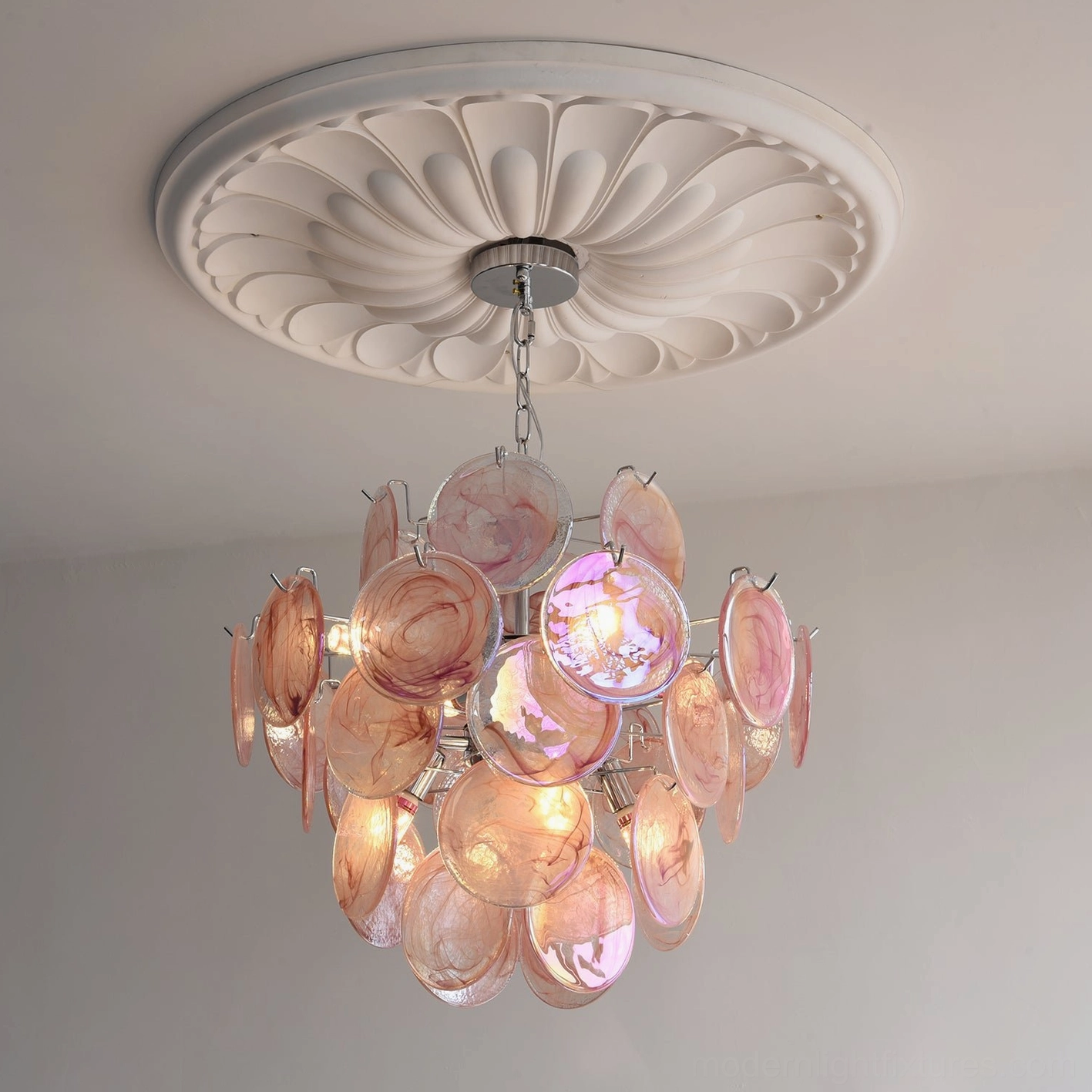 Ceiling installation view of large modern glass disc chandelier with decorative ceiling detail