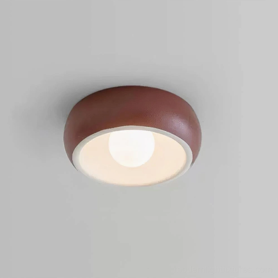 Ceiling light fixture in apartment bedroom with low ceiling constraints showing practical space solutions