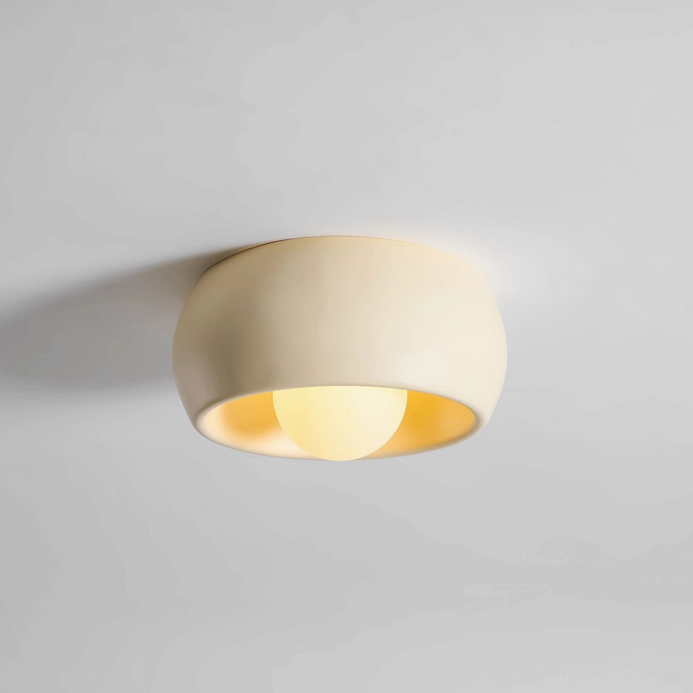 Ceiling light fixture installed in bathroom environment showing damp rated performance capability