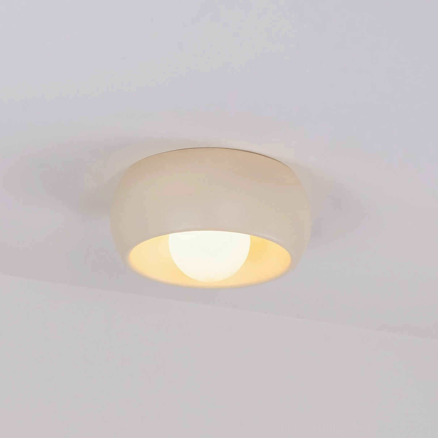 Carbon steel construction detail of circular ceiling fixture showing material durability and quality