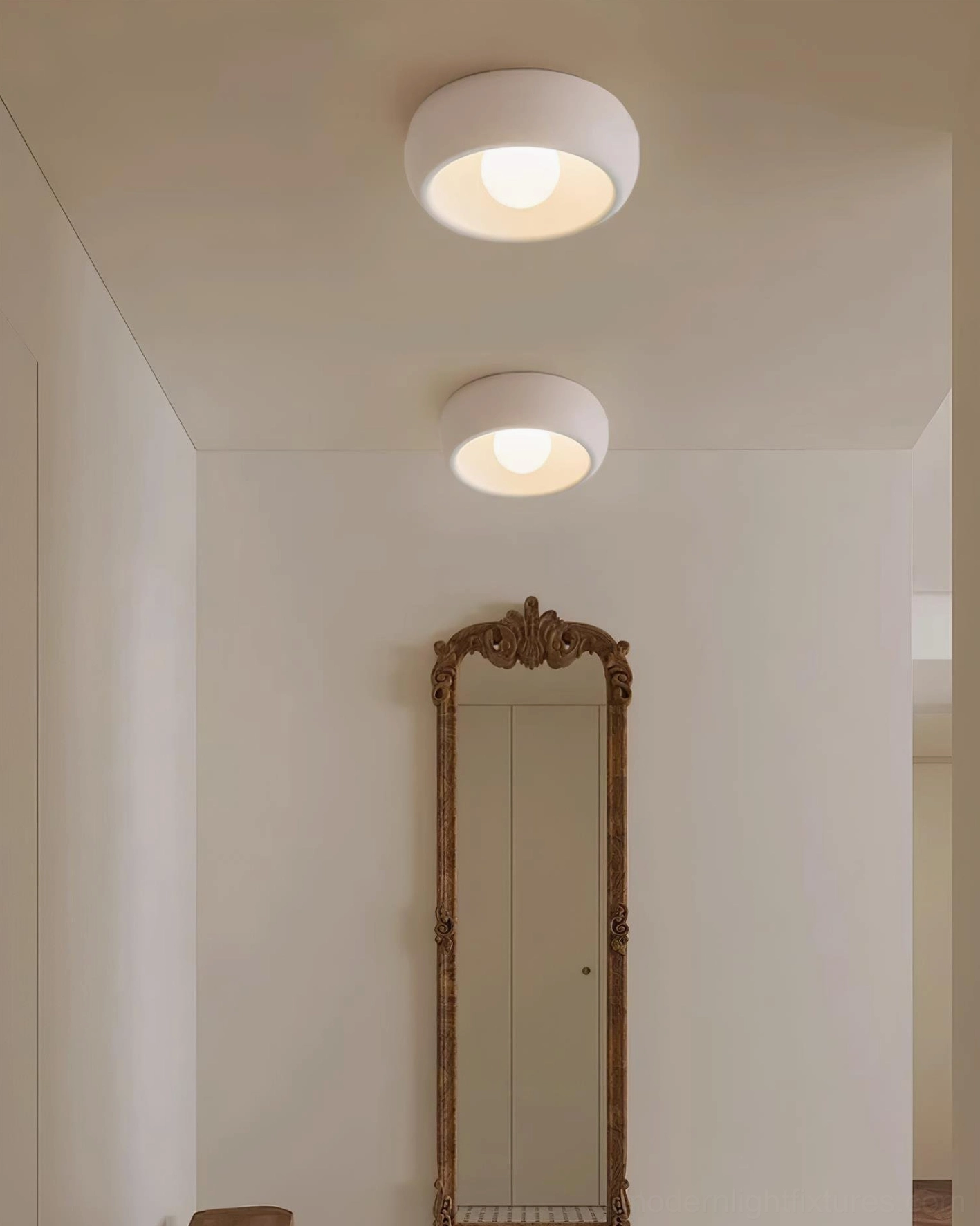 Ceiling light fixture with frosted glass component creating warm even light distribution without glare