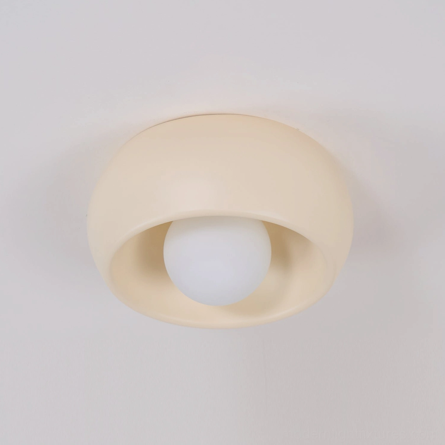 Ceiling light fixture in hallway demonstrating perfect fit for tight transitional residential spaces