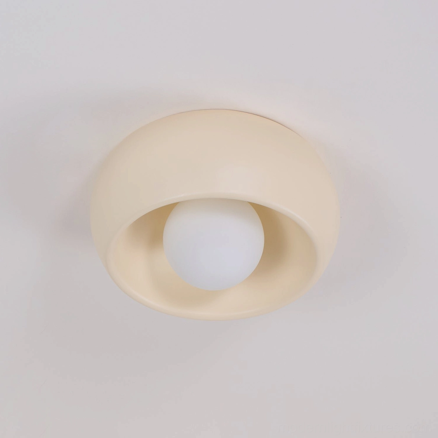 Ceiling light installation showing hardwired mounting to electrical box with clean integrated appearance