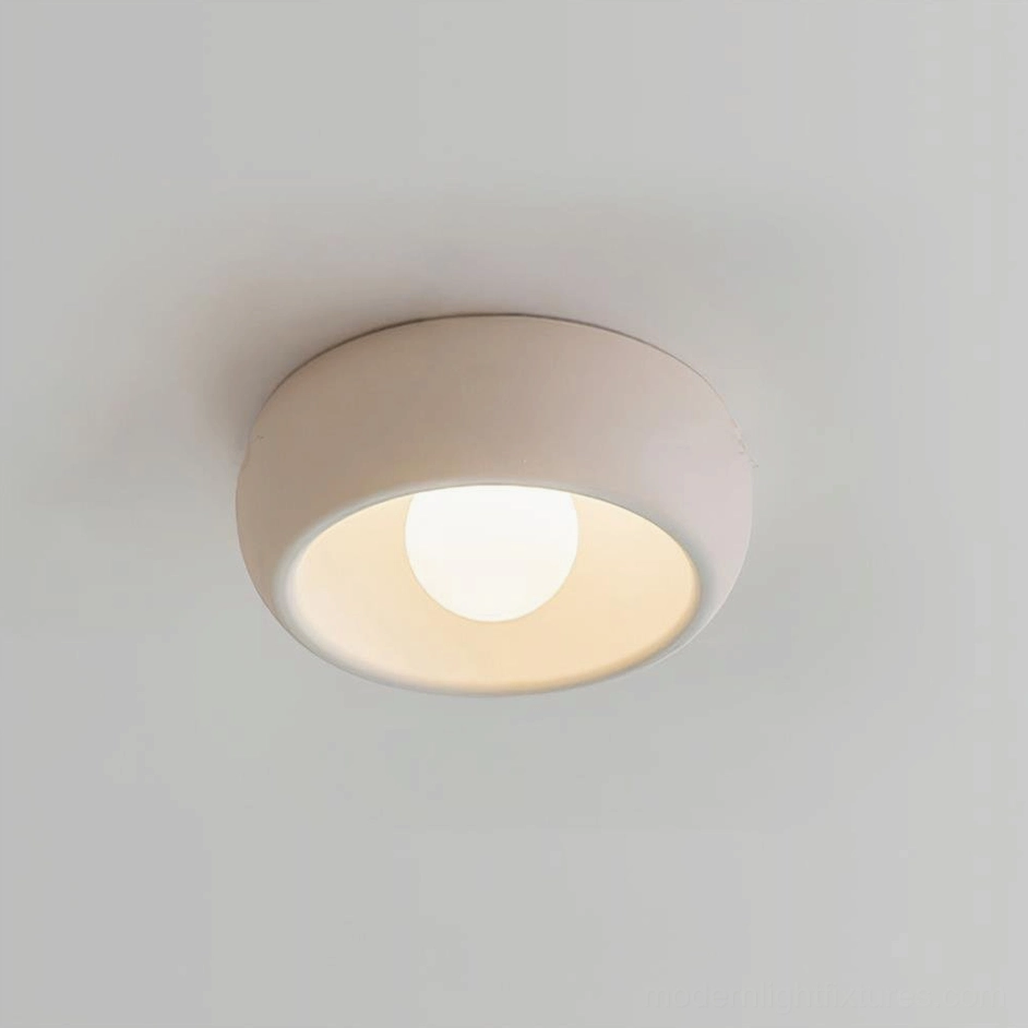 Clean minimalist design of circular ceiling light emphasizing Scandinavian aesthetic principles