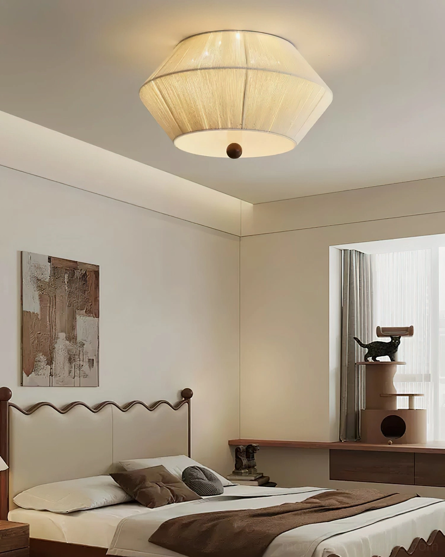 Modern tapered fabric ceiling light fixture showing dark spherical bottom finial design detail
