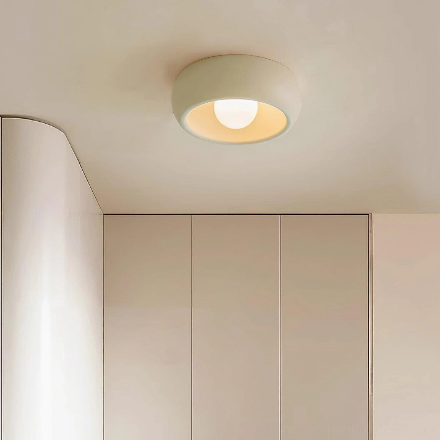 Compact ceiling fixture in transitional residential setting showing versatile style compatibility