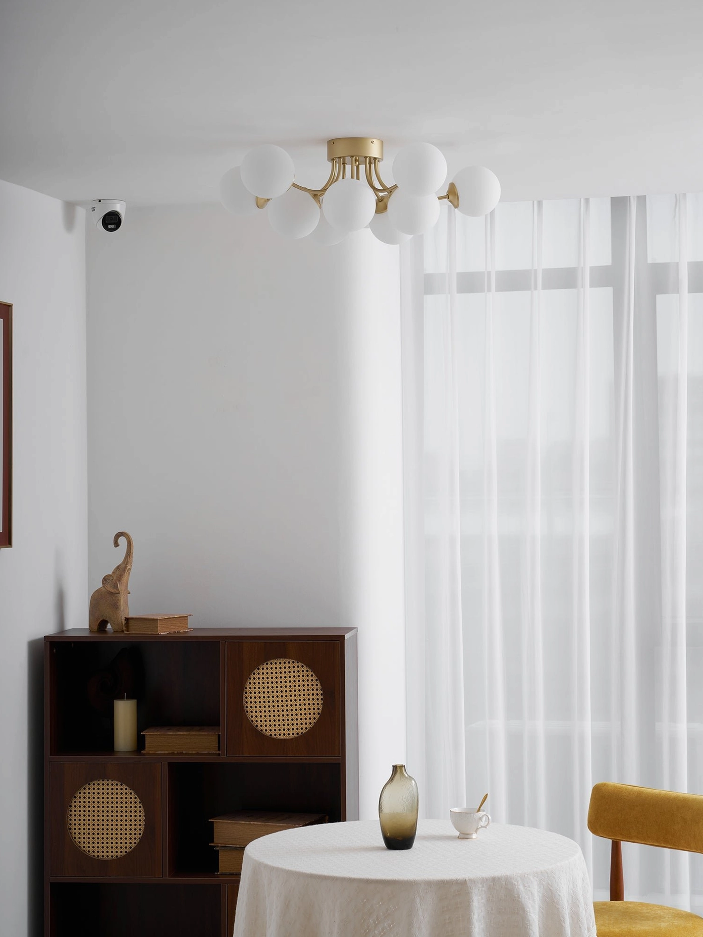Sputnik ceiling light showing warm light distribution through frosted glass ball shades