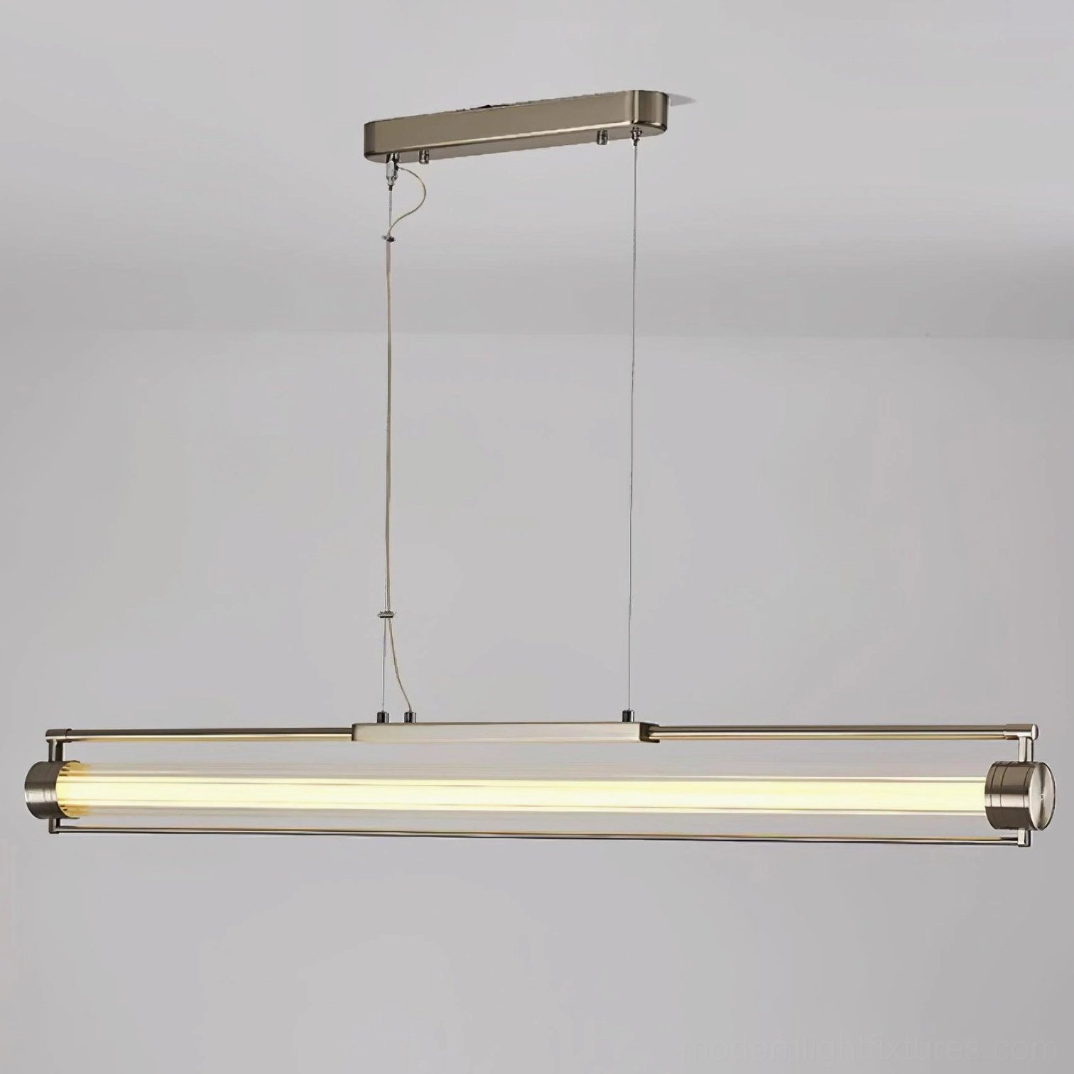 Modern linear glass tube pendant lamp mounted on ceiling - sleek minimalist lighting design with warm glow