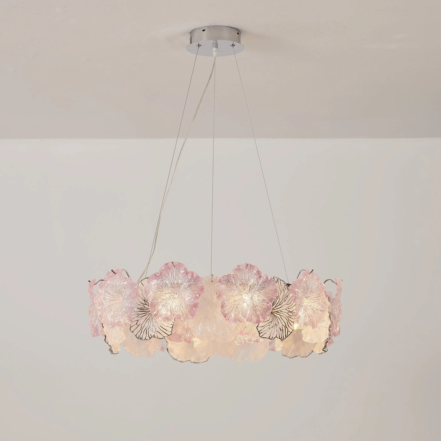 Celadine chandelier showing cable suspension detail with nearly invisible clear cables allowing hand-formed glass petals to appear floating