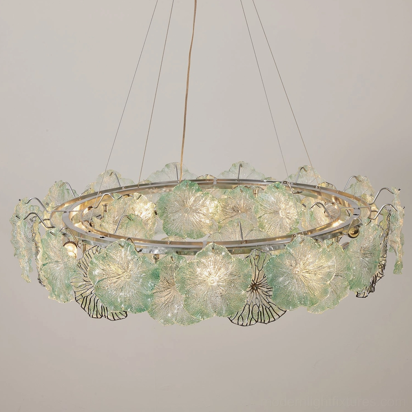 Celadine double-tiered glass flower chandelier showing polished chrome frame and clear cable suspension from above