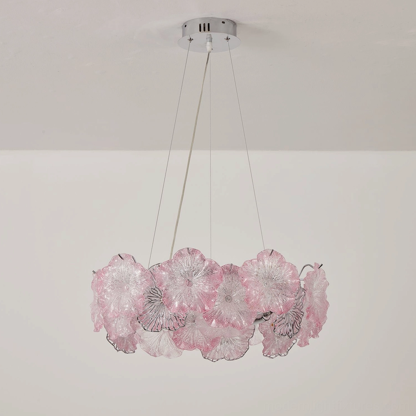 Celadine linear bar chandelier with hand-formed glass blossoms in seafoam green and clear, ceiling installation view
