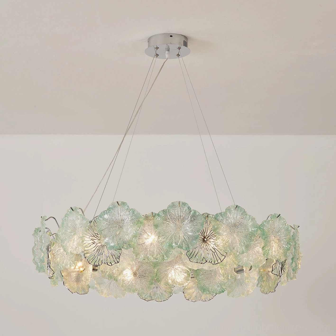 Celadine linear bar chandelier with hand-formed textured glass petals over kitchen island, modern minimalist interior design